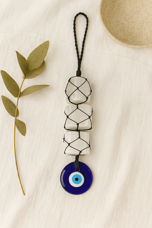 SELENITE WITH EVIL EYE HANGING